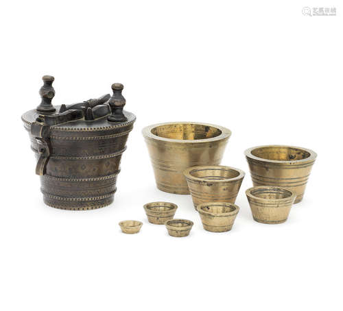 A large set of 17th century leaded bronze nested cup weights, Nuremberg