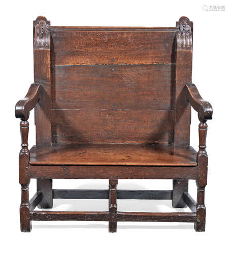 An unusual Charles II joined and boarded oak settle, circa 1680