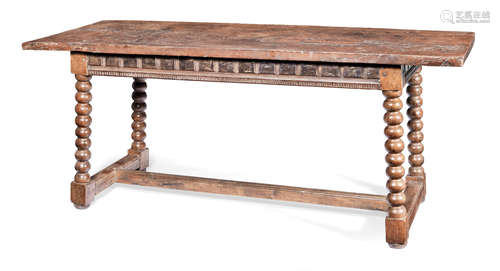 A 17th century and later walnut long table, Spanish