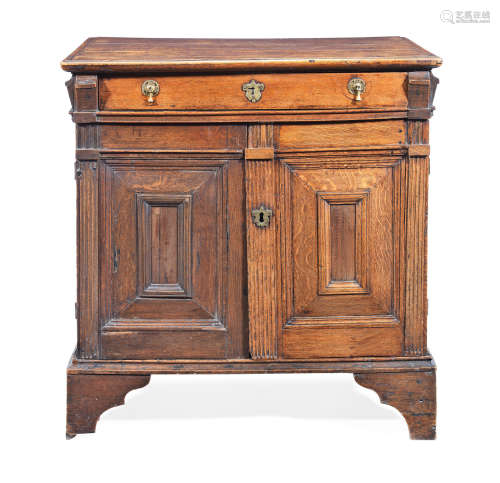 A small Charles II joined oak and snakewood-veneered enclosed chest of drawers, circa 1680