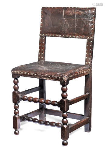 A Charles II joined oak and hide upholstered chair, circa 1660