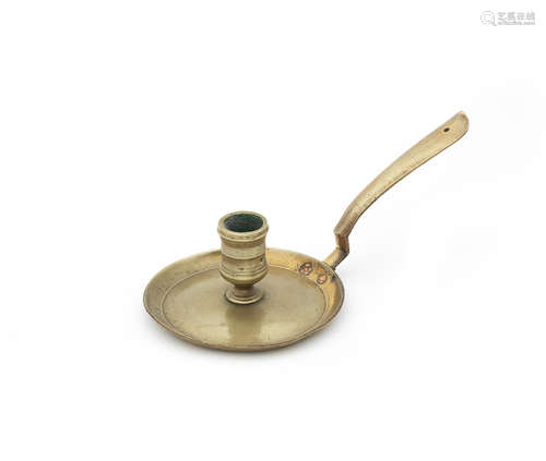 An early to mid-18th century cast brass socket chamberstick, English/French, circa 1700 - 1750