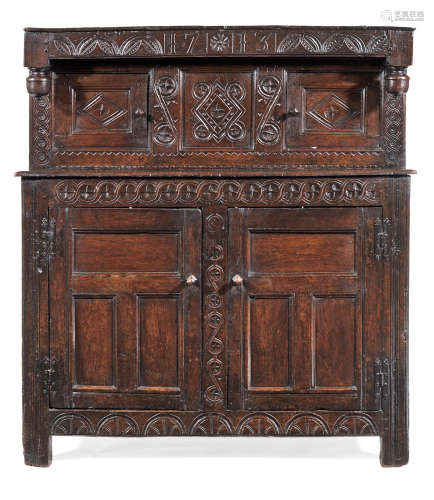 A Queen Anne joined oak court cupboard, West Country or South Wales, dated 1713