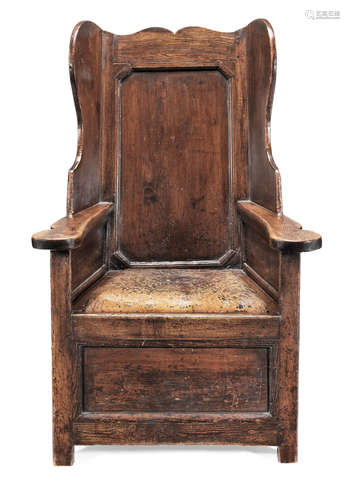 A George III joined pine and ash 'lambing' wing armchair, circa 1800