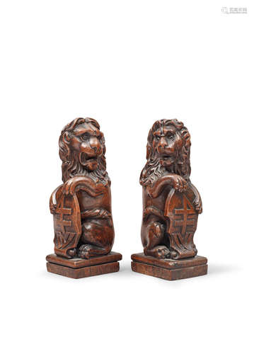 A pair of 19th century carved oak lion finials