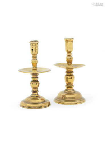 Two mid-17th century brass alloy socket candlesticks, of 'Heemskerk'-type, Low Countries, circa 1650