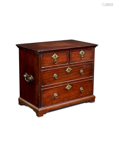 A George II walnut miniature chest of drawers, circa 1740
