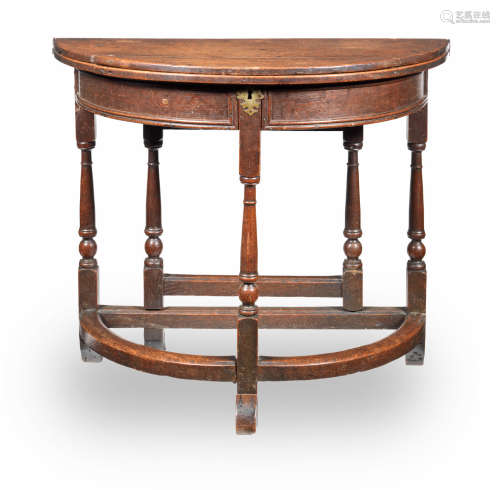 An early 18th century small oak half-round box-top folding table, English, circa 1710-30