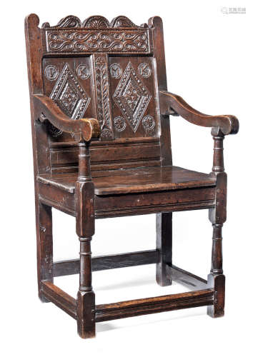 Probably made to commemorate a marriage A Charles II joined oak double panel-back open armchair, Lancashire, circa 1670