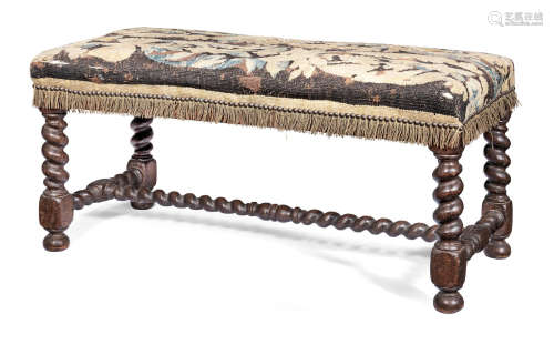 In the late 17th century style A joined oak and upholstered long stool, Flemish