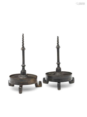 In the 14th/15th century manner A pair of bronze alloy pricket candlesticks