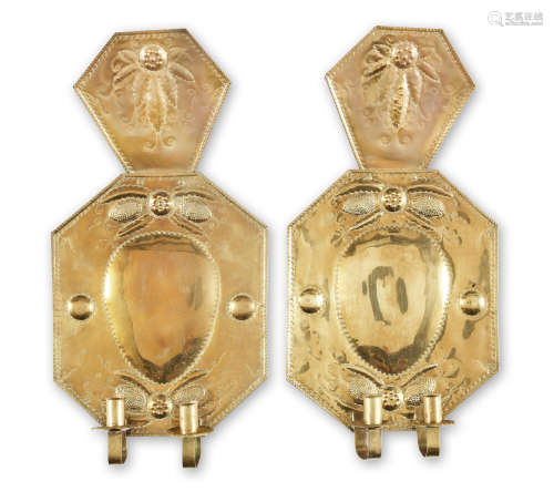 A large pair of late 17th century sheet brass wall sconces, Dutch