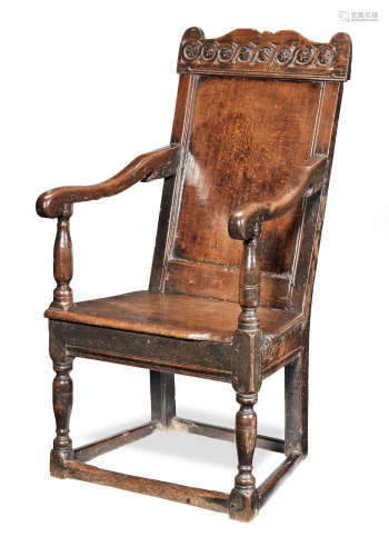 A Charles I joined oak panel-back open armchair, circa 1640
