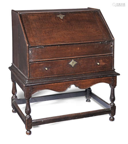 A Queen Anne joined oak desk-on-frame, circa 1715