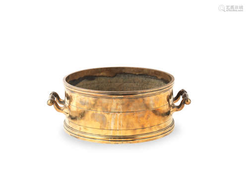 An early to mid-19th century brass alloy bushel measure, English, circa 1820 - 1850