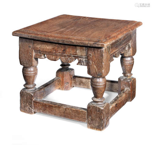 A Charles I oak child's low stool, circa 1630 and later