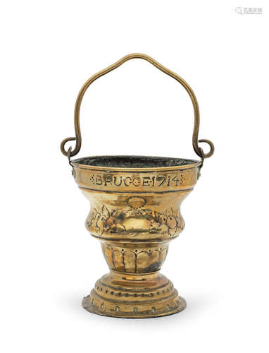 A rare early 18th century sheet brass holy water bucket, Bruges, dated 1714