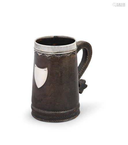 A white metal-mounted leather mug or tankard, English