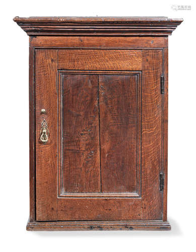 A George III joined oak and elm mural cupboard, circa 1760