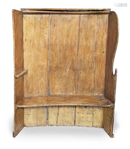 A George III pine and ochre-painted boarded bowed settle, West Country/South Wales, circa 1800