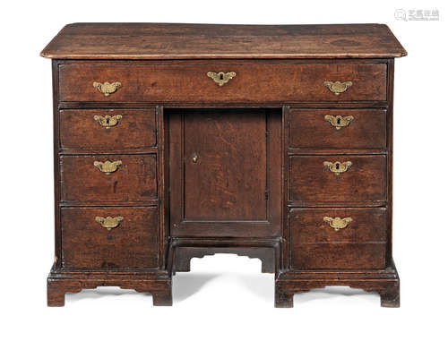 A George I joined oak knee-hole desk, circa 1725