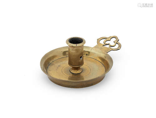 A rare late 17th/early 18th century cast brass socket chamberstick, with porringer-type handle, English, circa 1700