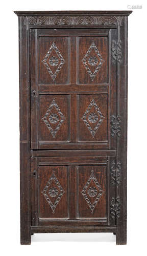 An unusual Charles I joined and boarded oak upright livery cupboard, West Country, circa 1640