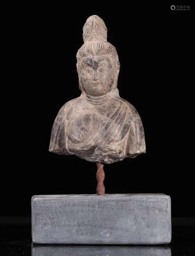 A BLUESTONE CARVED HALF BUDDHA