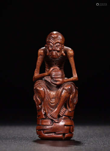 A WOOD CARVED LUOHAN BUDDHA