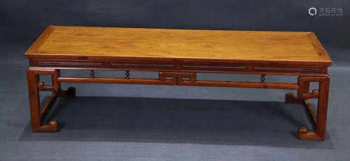 A HUANGHUALI WOOD CARVED LONG TABLE