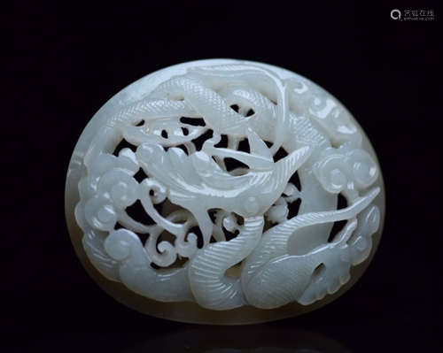 A HETIAN JADE CARVED HOLLOW DRAGON PATTERN PENDANT