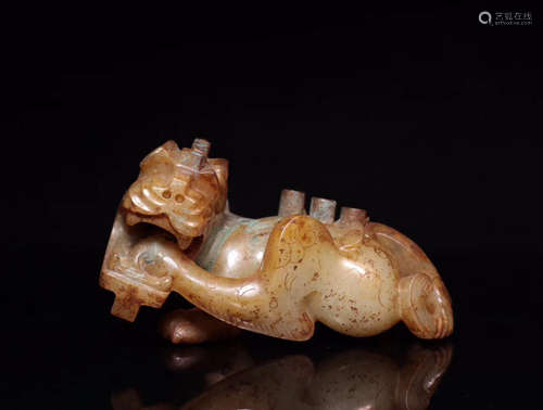 AN OLD JADE CARVED BEAST SHAPED PENDANT