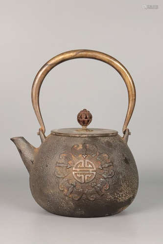 A IRON CASTED TEA POT