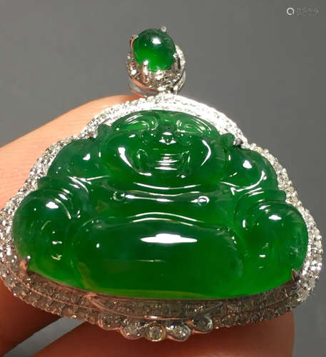 A GREEN JADEITE CARVED BUDDHA PENDANT, A CLASS