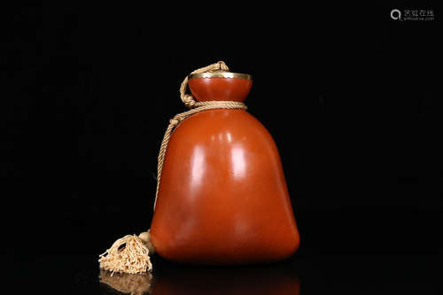 A GOURD CARVED RED MONEY POCKET