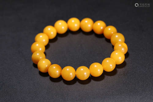 A BEESWAX CARVED BEADS STRING BRACELET