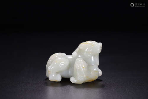 A HETIAN JADE CARVED BEAST SHAPED PENDANT