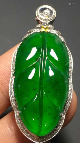 A GREEN JADEITE CARVED LEAF PENDANT, A CLASS