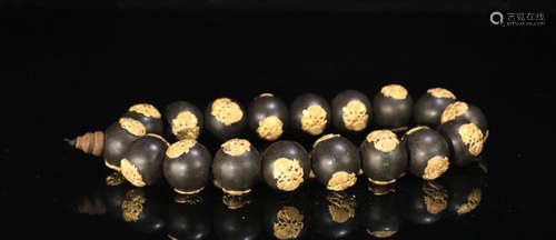 A GILT SILVER CHENXIANG WOOD BEADS STRING BRACELET