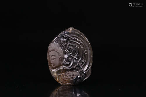 A CITRINE CARVED BUDDHA HEAD PATTERN PENDANT