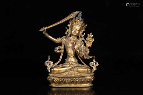 A GILT BRONZE CASTED MANJUSHRI BUDDHA