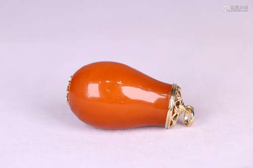 A CALABASH DESIGN BEESWAX PENDANT