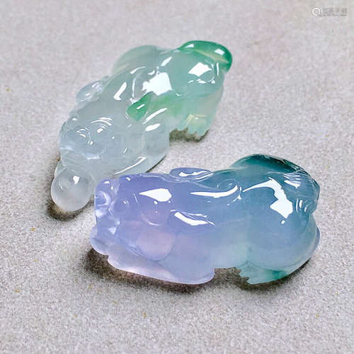 A PAIR OF BEAST DESIGN JADEITE PENDANTS