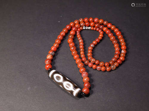 AN OLD TIBETAN THREE-EYE DZI-BEAD