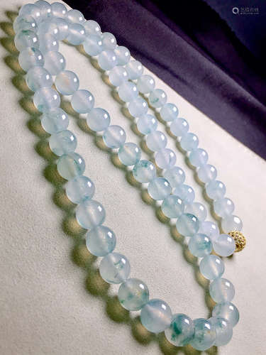 A STRING OF ICE JADEITE BEADS NECKLACE