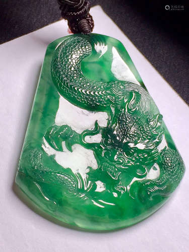 A DRAGON DESIGN ZHENGYANG GREEN ICE JADEITE PENDANT