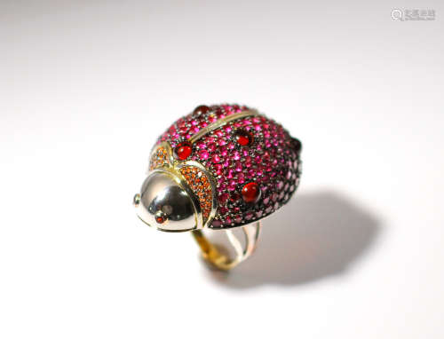 A large high quality gold over sterling designer ring depicts a ladybug