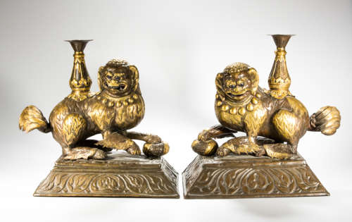 A rare Buddhist lions guild metal candle holders