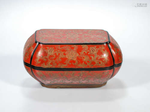 A Chinese red lacquer gild box decorated with scrolls and flowers