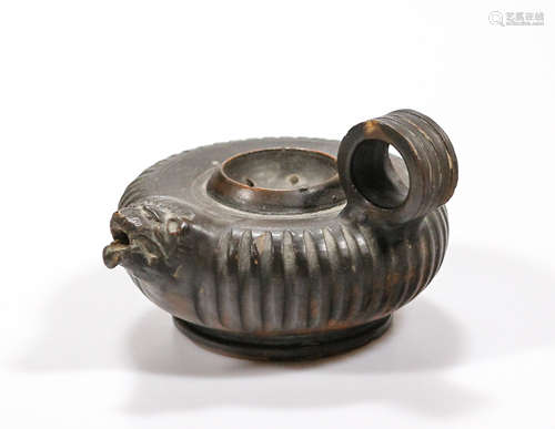 A Greek Campanian terracotta black-glazed guttus with lion headed spout